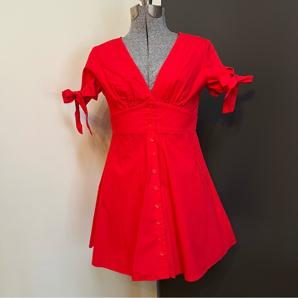 Cutest red button-up dress with short sleeves and bow tie-up detail